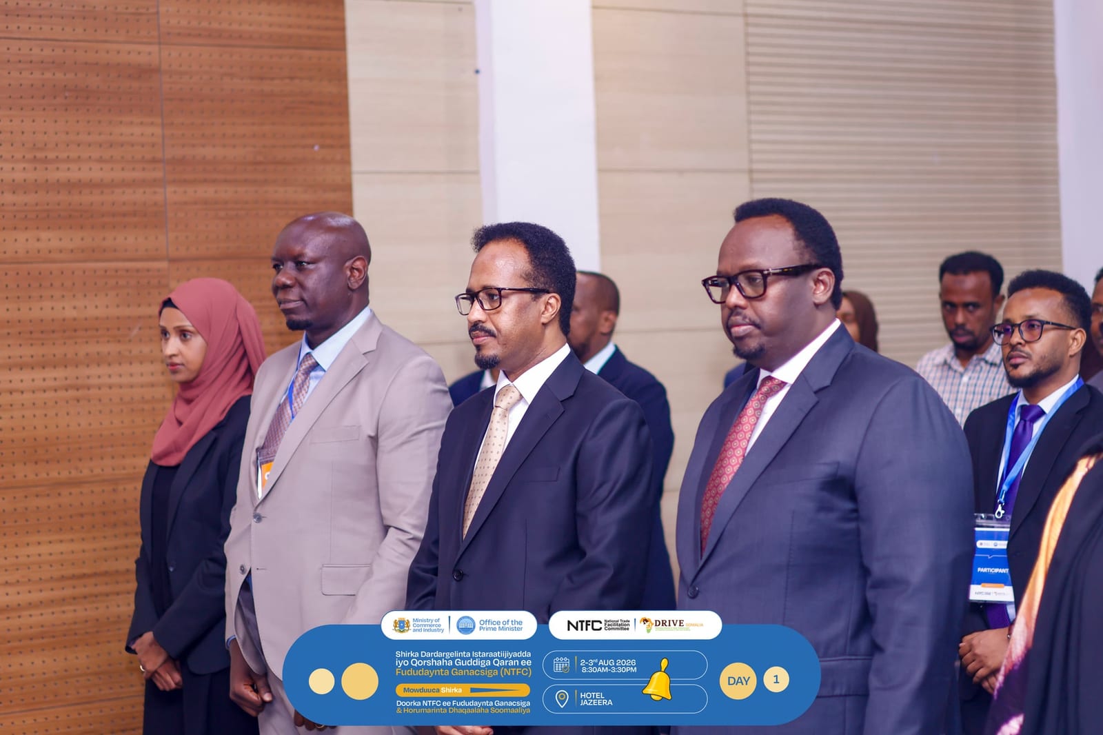 Delegates stand together at the trade facilitation workshop