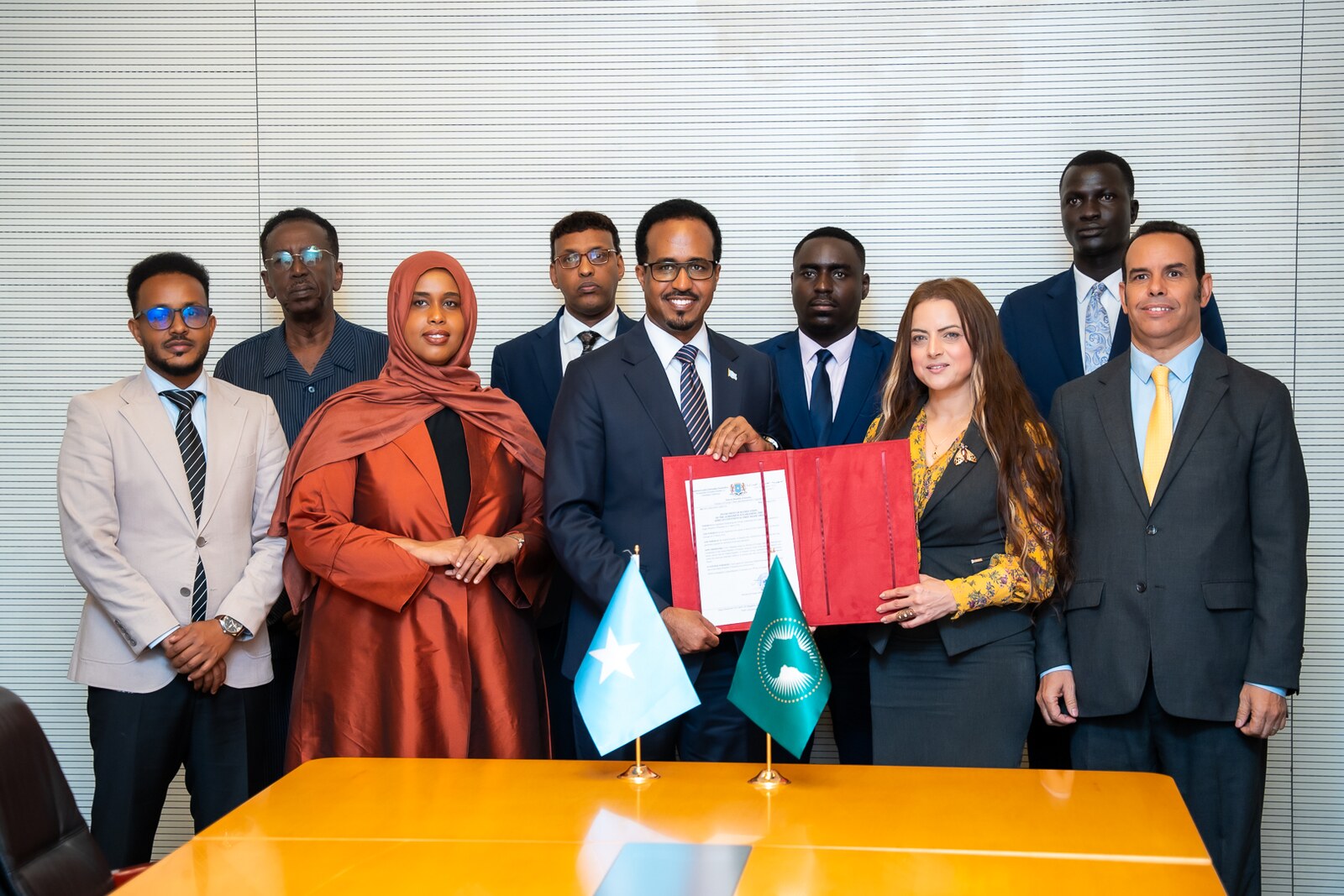 Somali and African Union officials with the ratification instrument in Addis Ababa.